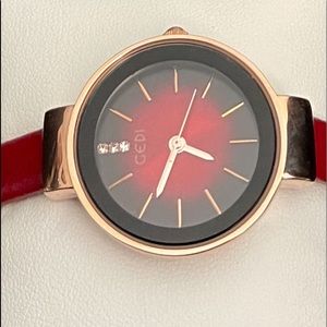 New Ruby red and gold tone ladies watch.